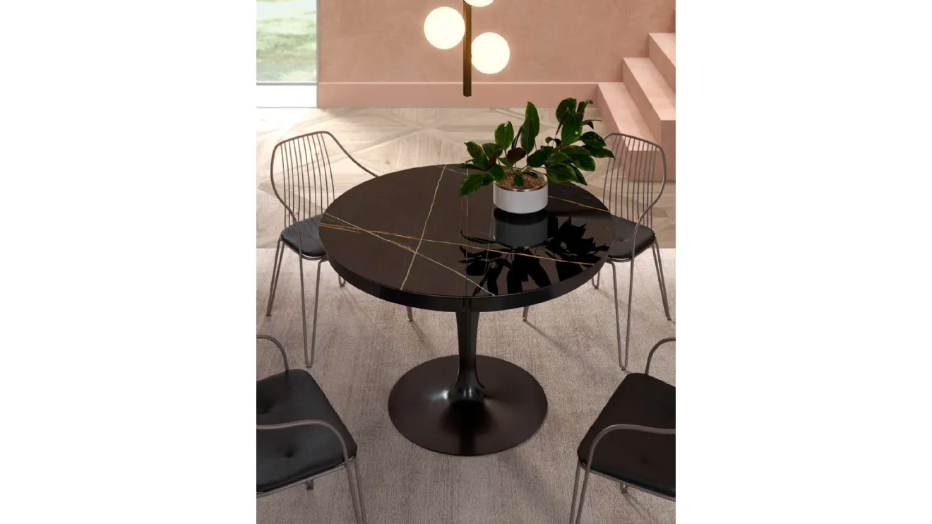 Tavolo rotondo allungabile Eclipse con top in marble glass Sahara Noir Lucido di Ozzio